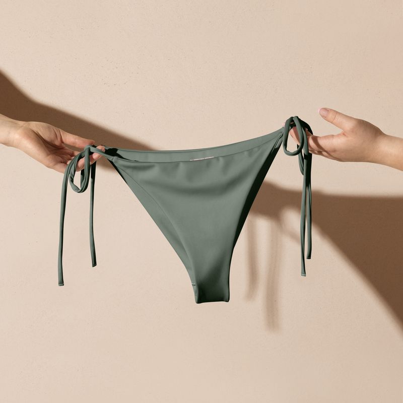 Greyish sage green string bikini bottom is also available in plus sizes.