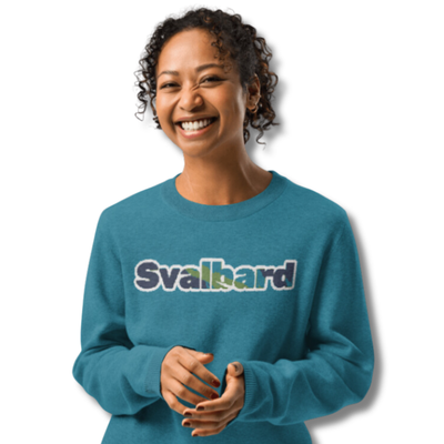 Cyan knitted crew neck sweater with text Svalbard and the Northern lights