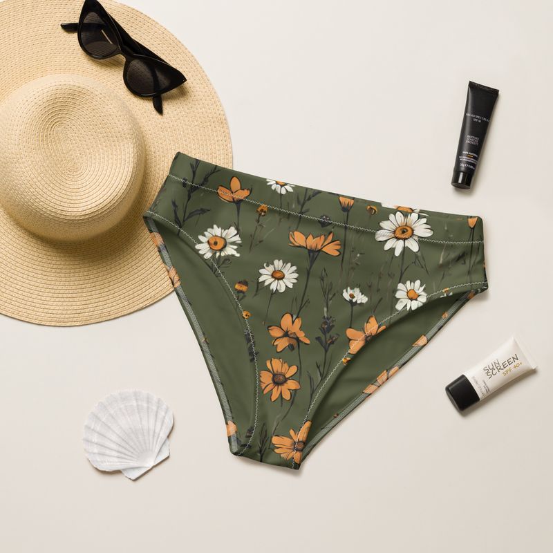 Olive green high-waisted bikini bottoms with retro daisies have a flattering fit. They look stunning also on mid-size and plus size girls.