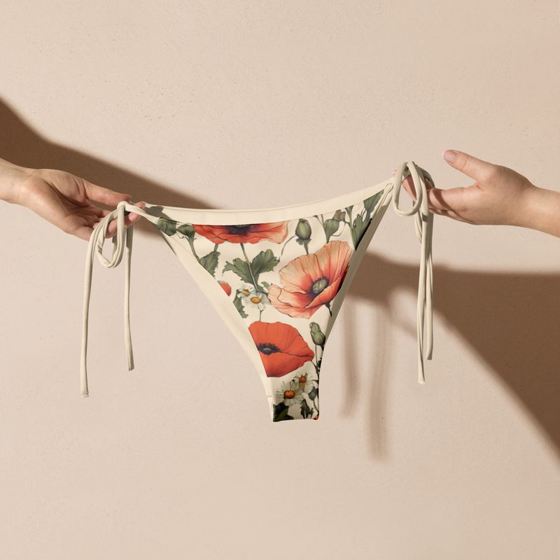 Retro yellow string bikini bottoms with poppy flowers and perfect for all nature lovers. 