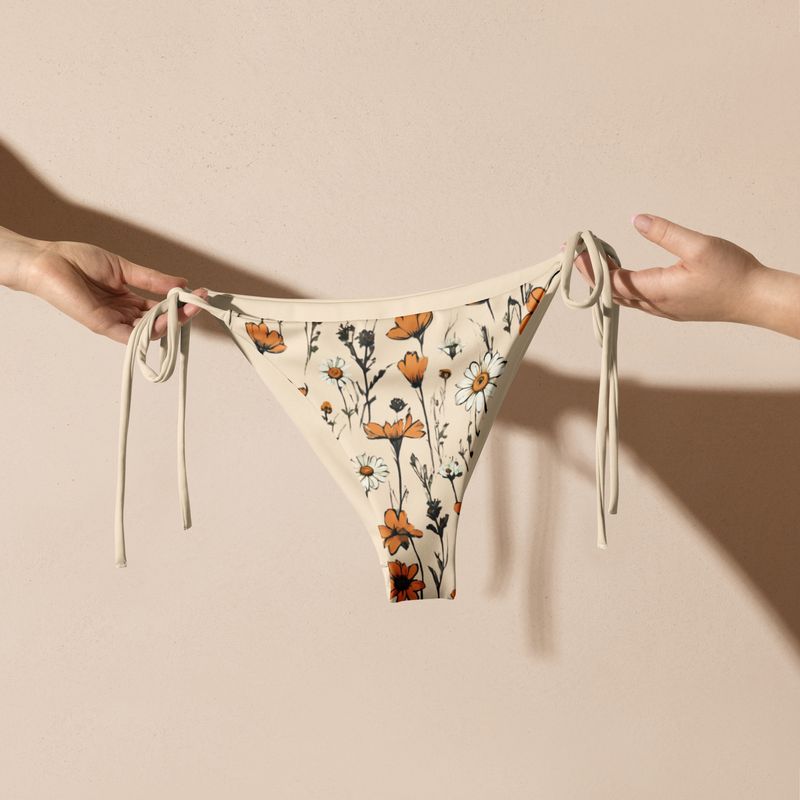 Retro yellow string bikini bottoms with retro flowers are stunning.