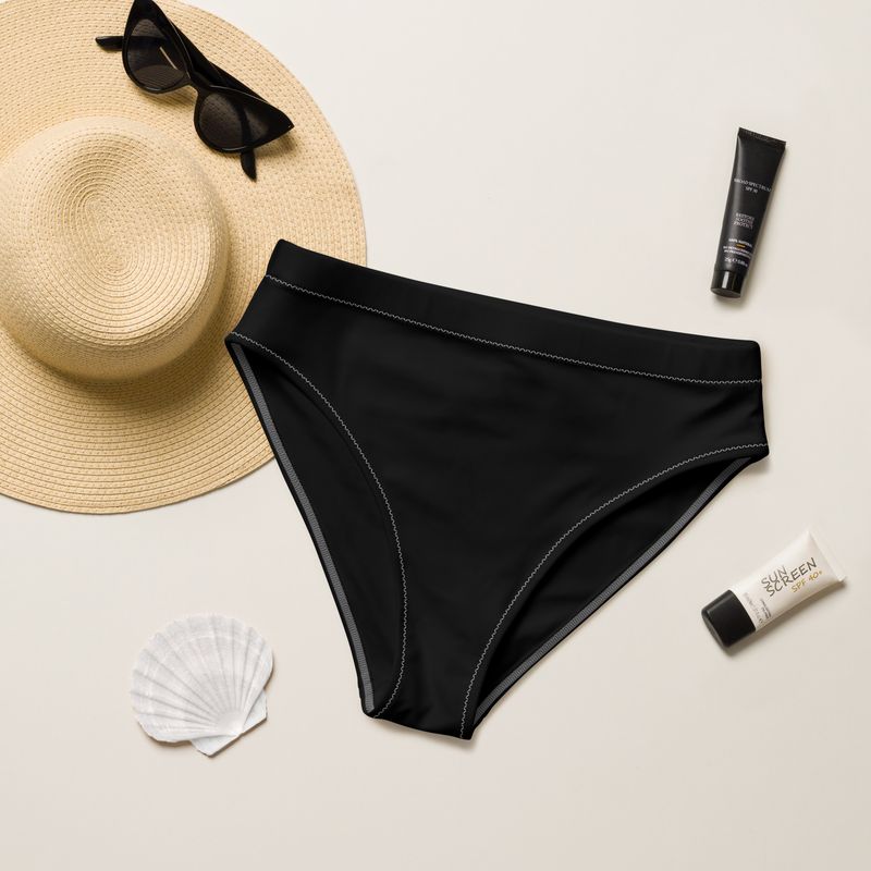The black high-waisted bikini bottom is lined. The lining is black. The stitching is white to add something extra.