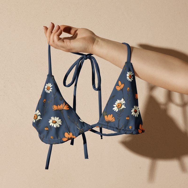 Grey blue triangle bikini top with retro flowers. The lining is grey-blue.
