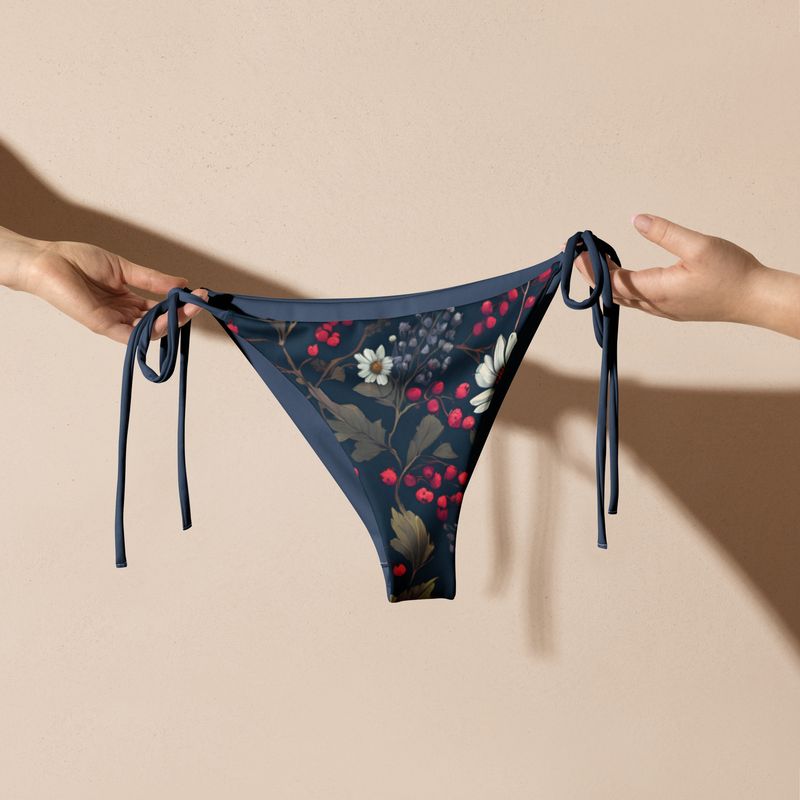 Grey blue string bikini bottoms feature beautiful wildflowers and wild berries. 