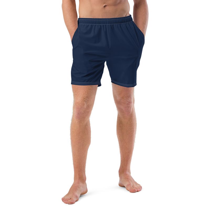 Navy blue swim trunks have pockets and anti-chafe lining.