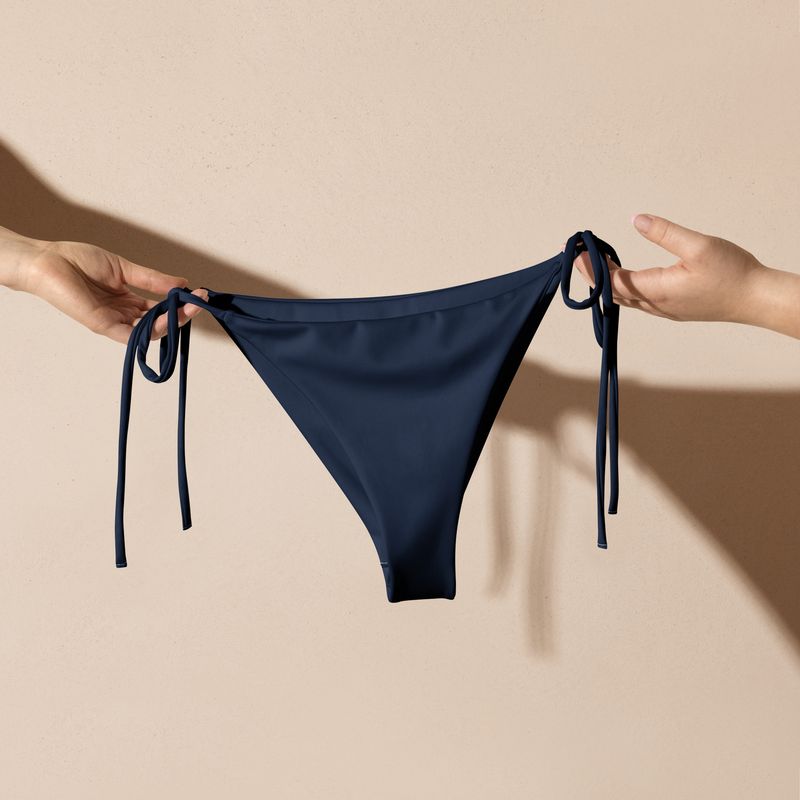 The navy blue string bikini bottom has navy blue lining. Sizes from XS to 3XL.
