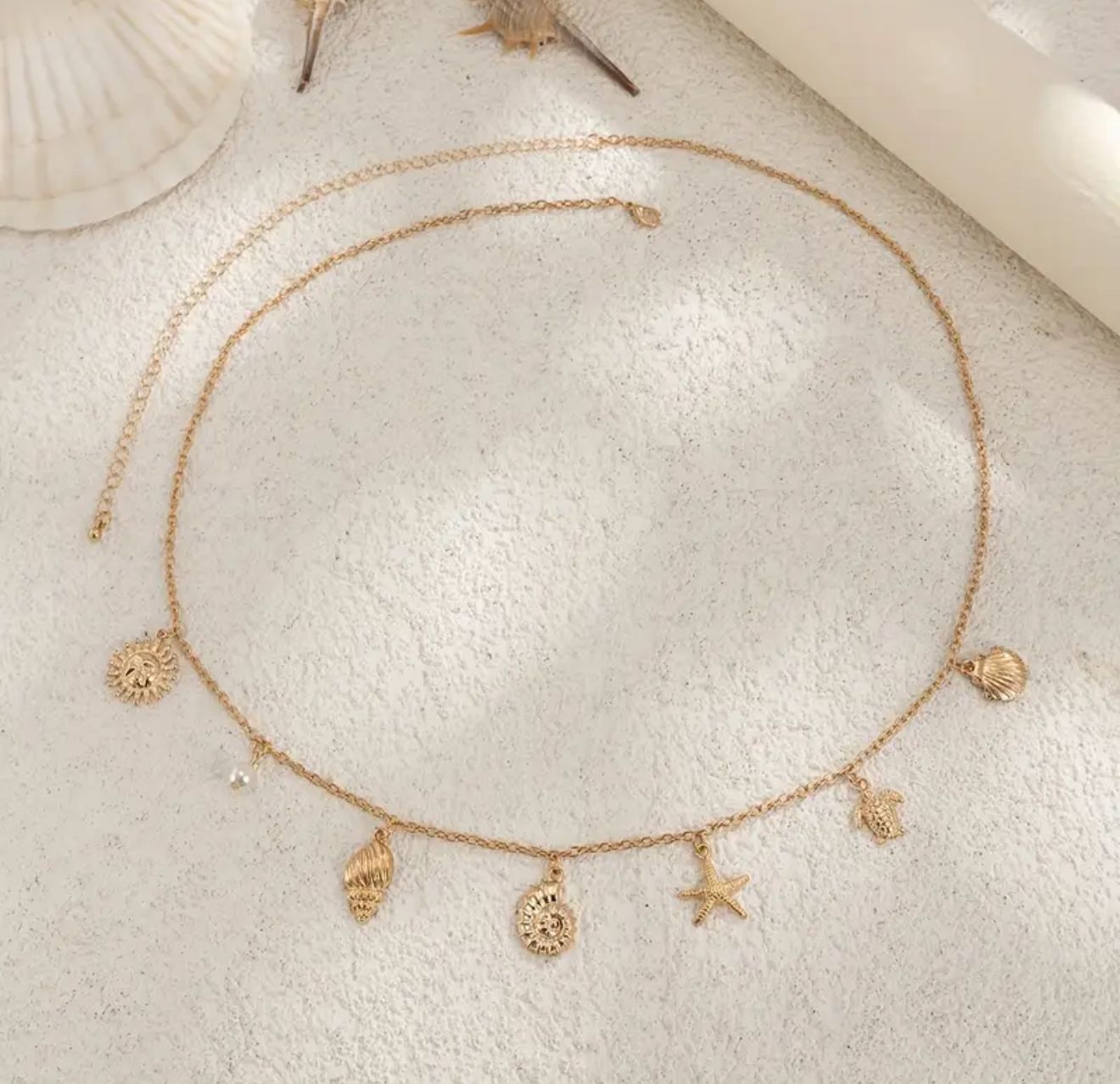 Golden Tides Waist Chain — Ocean-Inspired Body Jewelry Featuring Seashell, Starfish, Turtle & Sun Motifs in Polished Gold Alloy. Accented with Lustrous Pearls, Perfect for Beach Escapes Golden Tides Waist Chain — Ocean-Inspired Body Jewelry Featuring Seashell, Starfish, Turtle & Sun Motifs in Polished Gold Alloy. Accented with Lustrous Pearls, Perfect for Beach Escapes