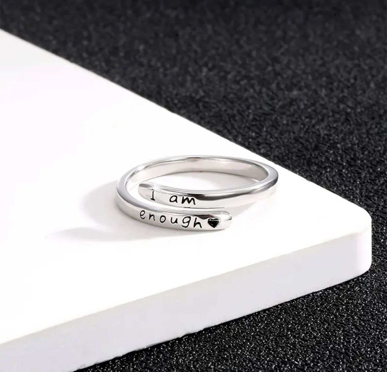 I AM ENOUGH Ring — A Refined Stainless Steel Open Band with Subtle Carved Letter Details. Adjustable for Comfort, Perfect for Daily Adornment or as a Thoughtful Gift of Meaning and Style I AM ENOUGH Ring — A Refined Stainless Steel Open Band with Subtle Carved Letter Details. Adjustable for Comfort, Perfect for Daily Adornment or as a Thoughtful Gift of Meaning and Style