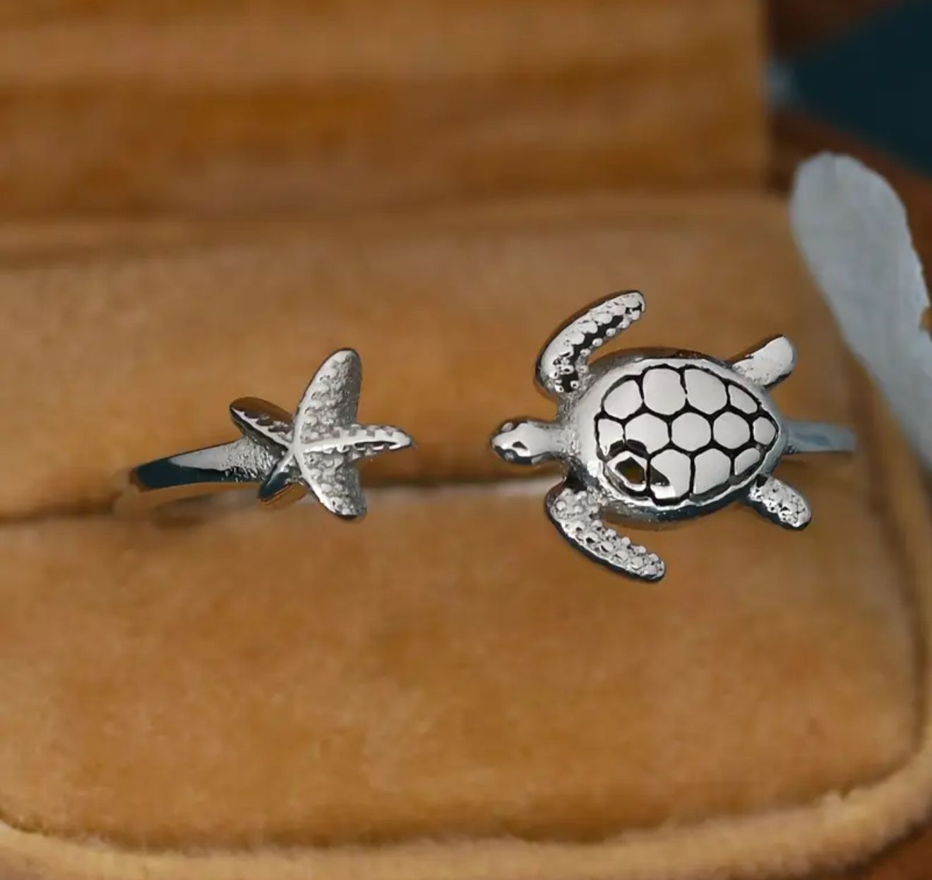Celestial Sea Turtle Ring — Inspired by the eternal rhythm of the ocean, this bohemian-luxury creation pairs the wisdom of the sea turtle with the radiant energy of the starfish Celestial Sea Turtle Ring — Inspired by the eternal rhythm of the ocean, this bohemian-luxury creation pairs the wisdom of the sea turtle with the radiant energy of the starfish