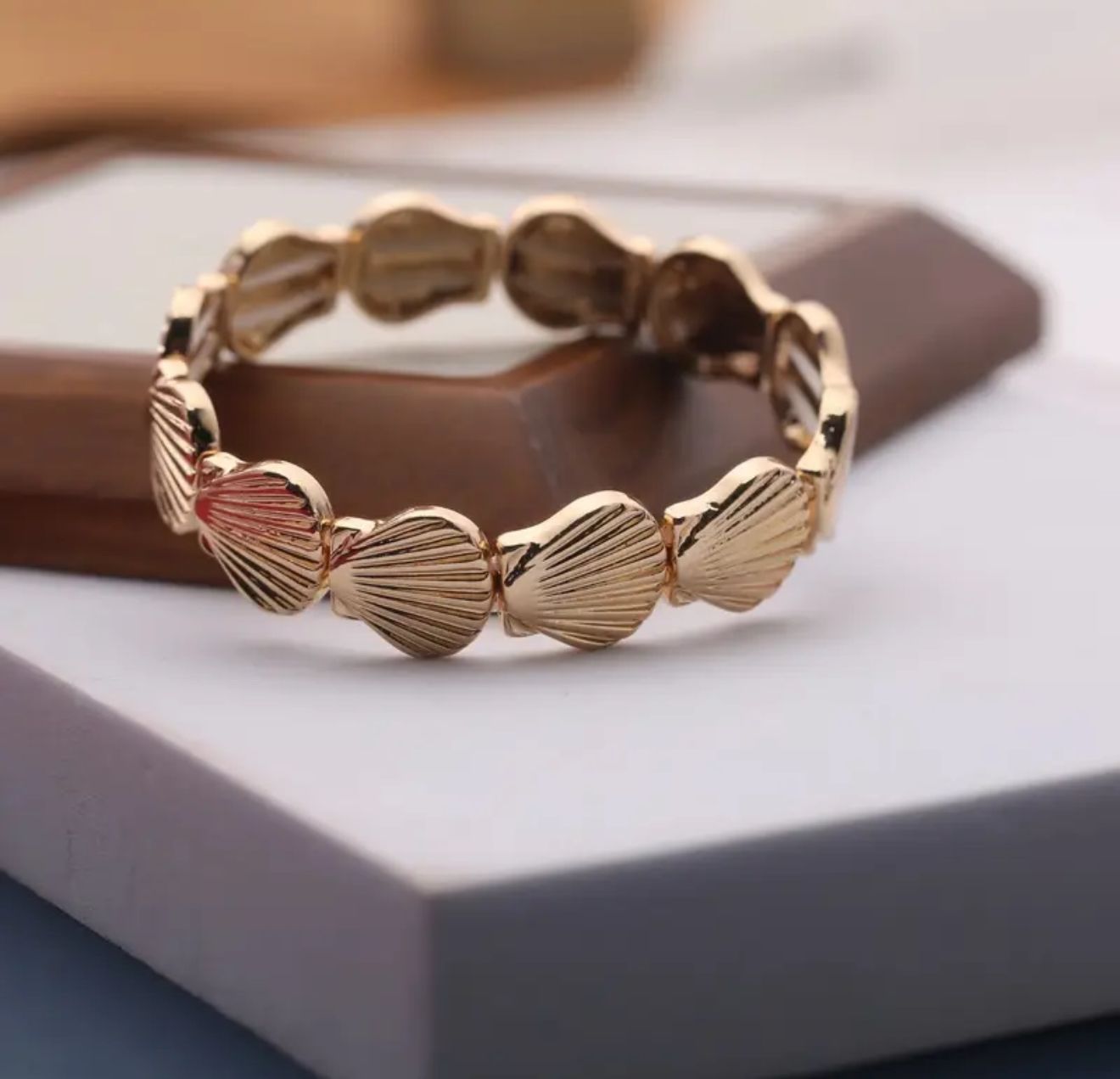 Seashell Grace Ring— An adjustable scallop-inspired cuff in polished gold alloy, blending coastal charm with refined simplicity. Perfect for beach vacations, and seaside dinners Seashell Grace Ring— An adjustable scallop-inspired cuff in polished gold alloy, blending coastal charm with refined simplicity. Perfect for beach vacations, and seaside dinners