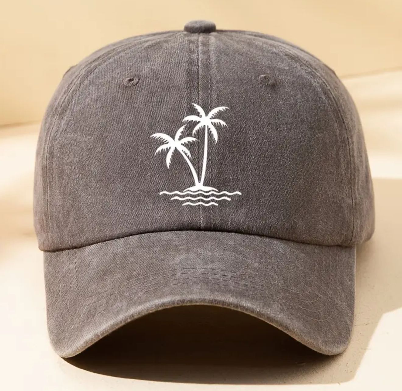 Island Paradise Baseball Cap -A vintage-washed baseball hat featuring a delicate coconut tree print. With its soft, distressed texture and adjustable fit, this sun-kissed essential Island Paradise Baseball Cap -A vintage-washed baseball hat featuring a delicate coconut tree print. With its soft, distressed texture and adjustable fit, this sun-kissed essential