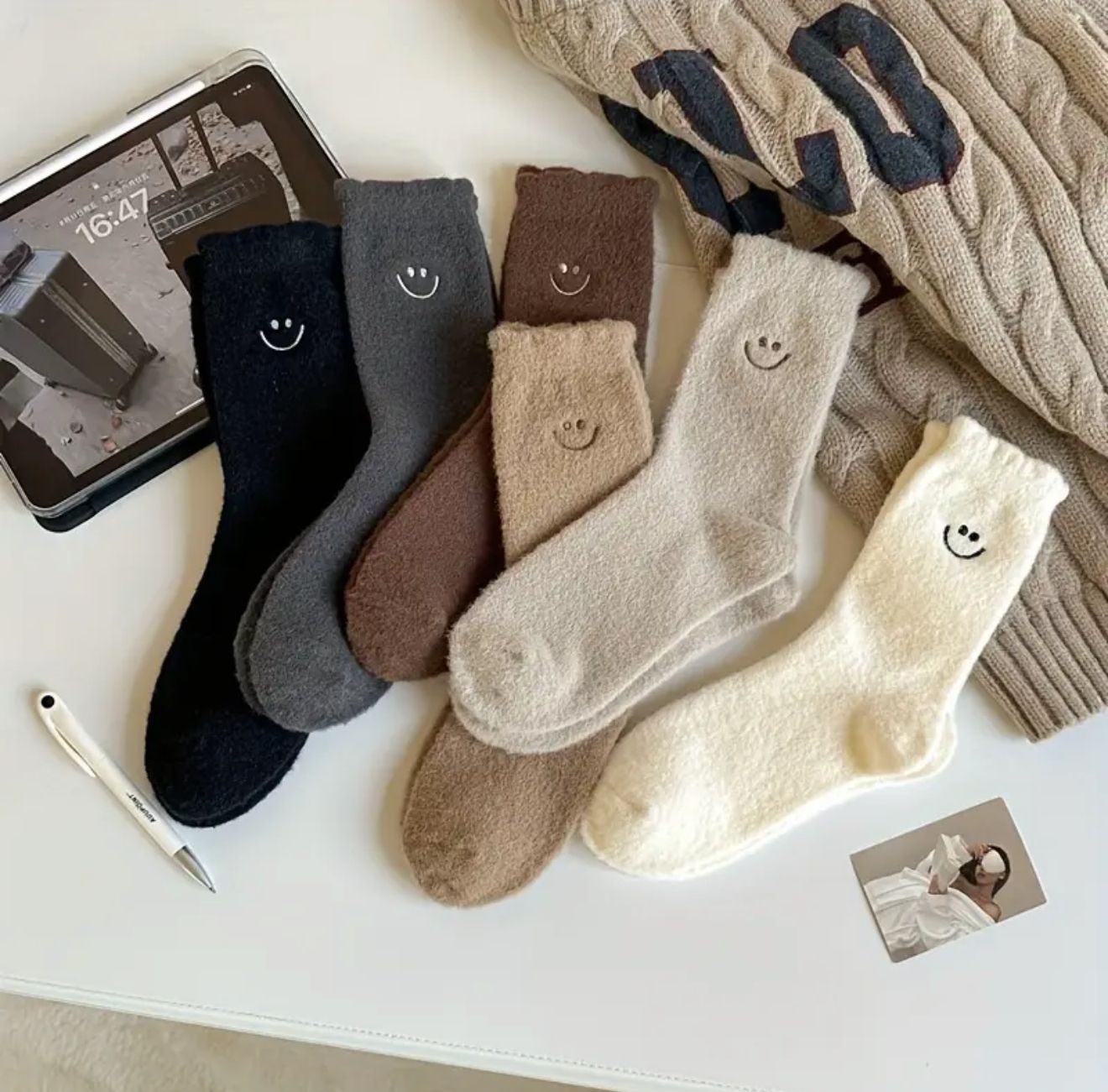 The Seraphic Smile Socks — A heavenly-soft set of plush knee-highs lined in fleece for divine comfort. Adorned with joyful smile faces and crafted in serene earth tones, they radiate warmth The Seraphic Smile Socks — A heavenly-soft set of plush knee-highs lined in fleece for divine comfort. Adorned with joyful smile faces and crafted in serene earth tones, they radiate warmth