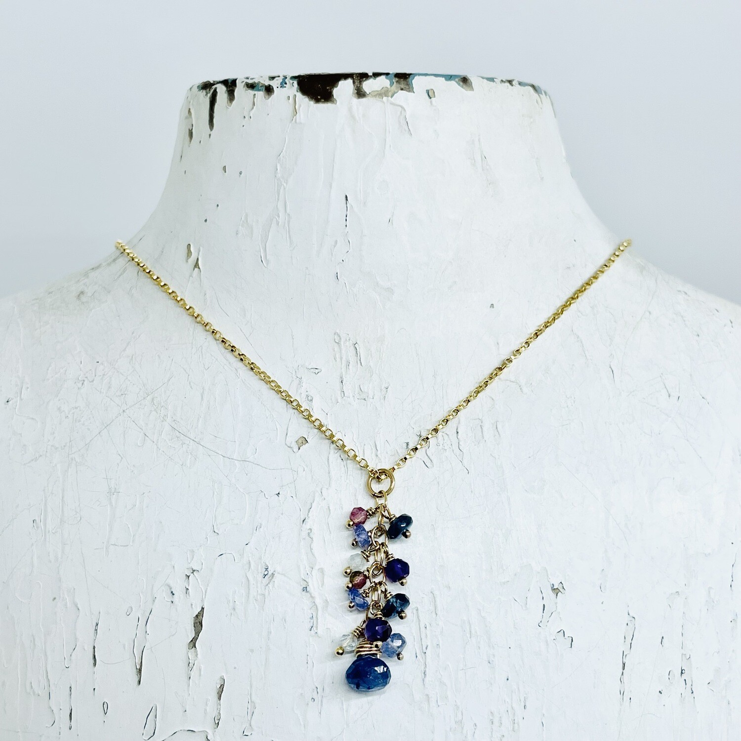 Handmade Necklace with 14 k g.f. chain, dangle blue sapphire, garnet, tanzanite, aquamarine