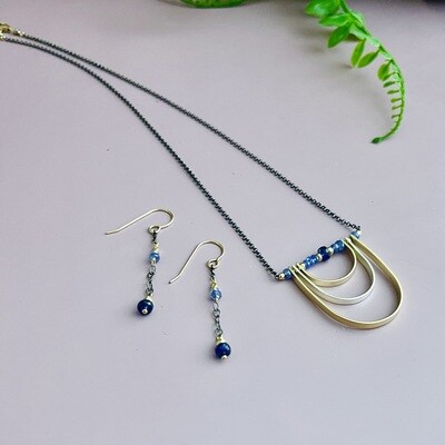 Tanzanite, blue sapphire, mixed metals curve necklace, 18"