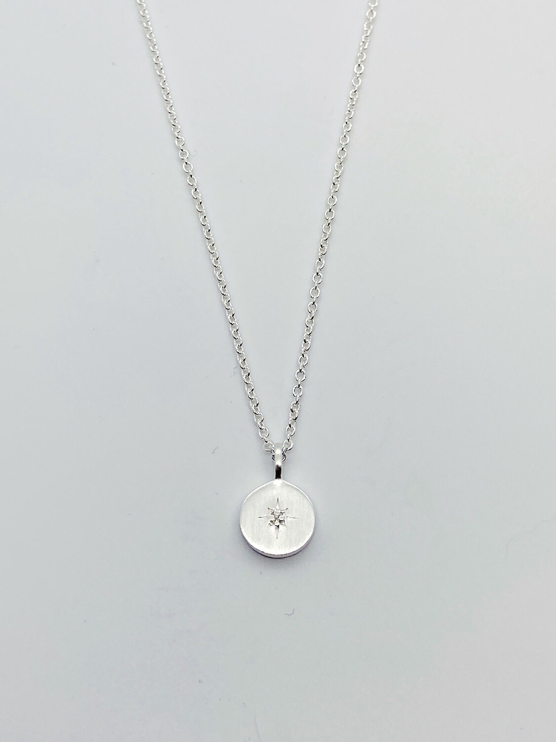 Brushed Sterling Silver Disc with star-set cz necklace