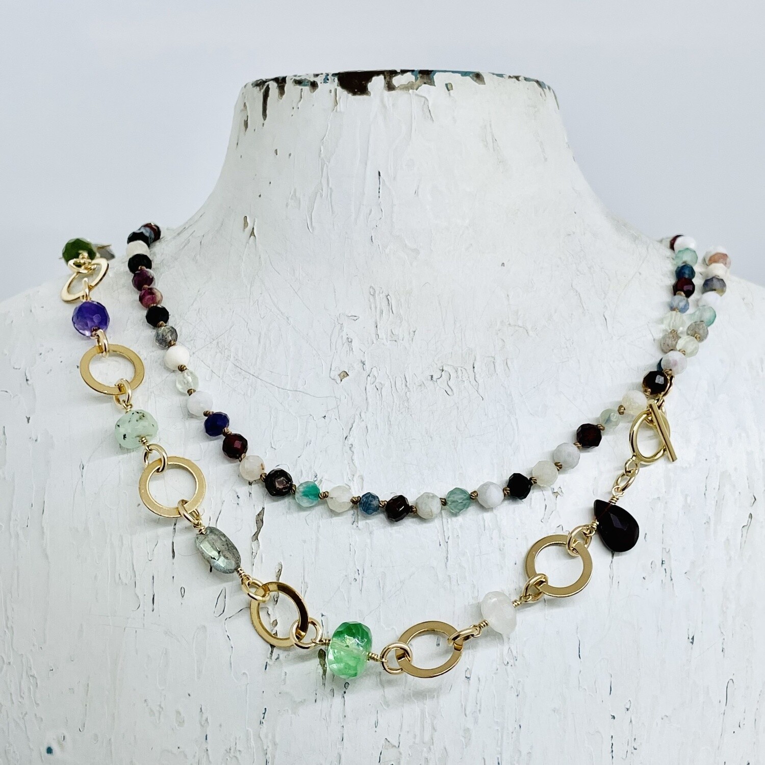 Handmade Necklace with misc semi precious stones knotted on natural silk with 14 k g.f. washers, toggle