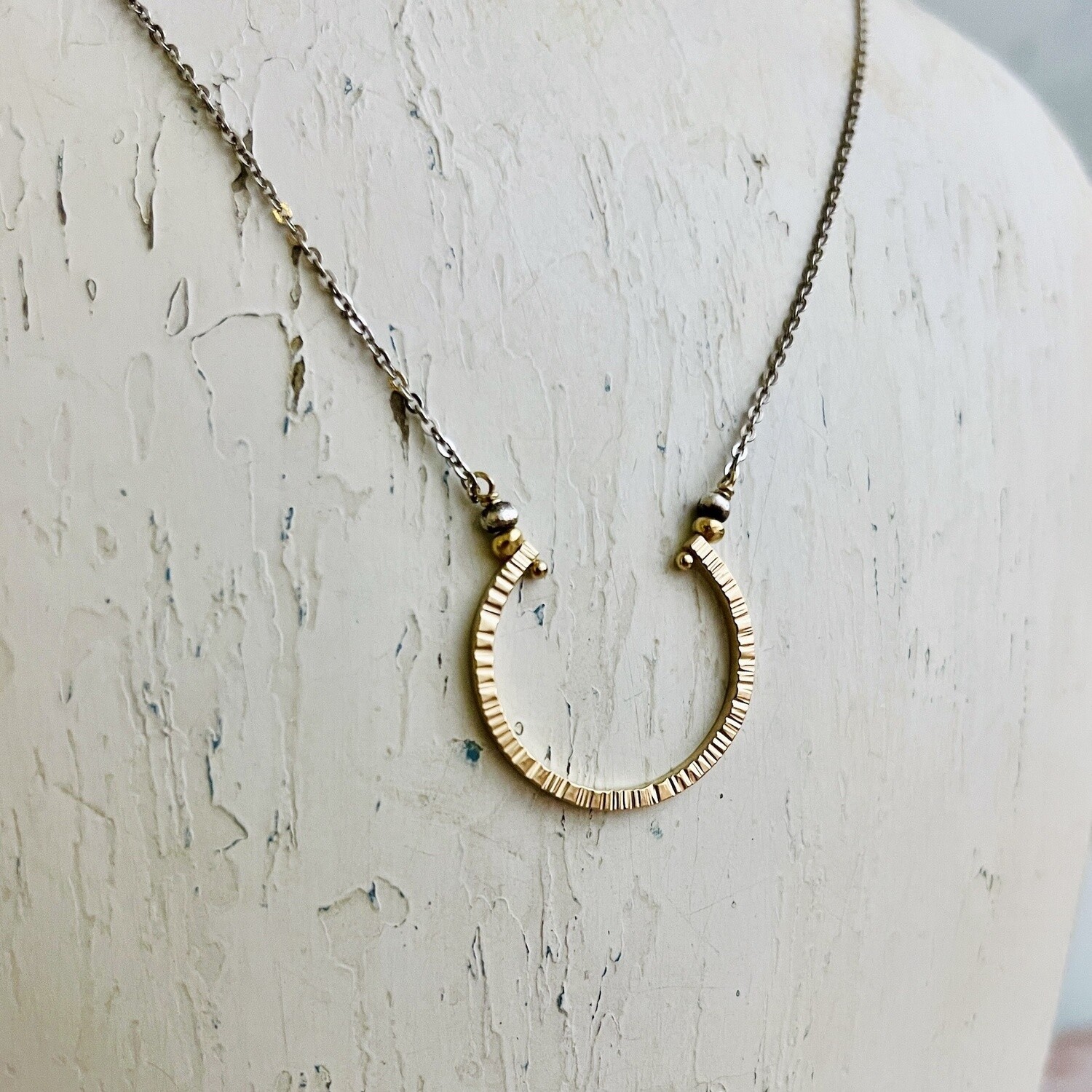 Textured 14kt gold filled horseshoe necklace on oxidized sterling chain