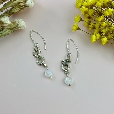 Handmade Earrings with on textured marquis wires with hammered silver rings and round moonstone drops