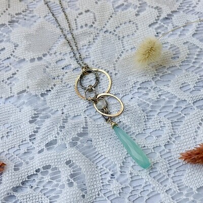 Handmade Necklace with hammered 14 k g.f. round and oval rings, peruvian chalcedony and rainbow moonstone drop
