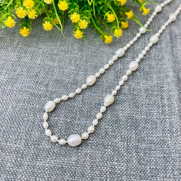 Handmade Silver Necklace with white baroque and oval pearls knotted on white silk, handmade faceted silver toggle
