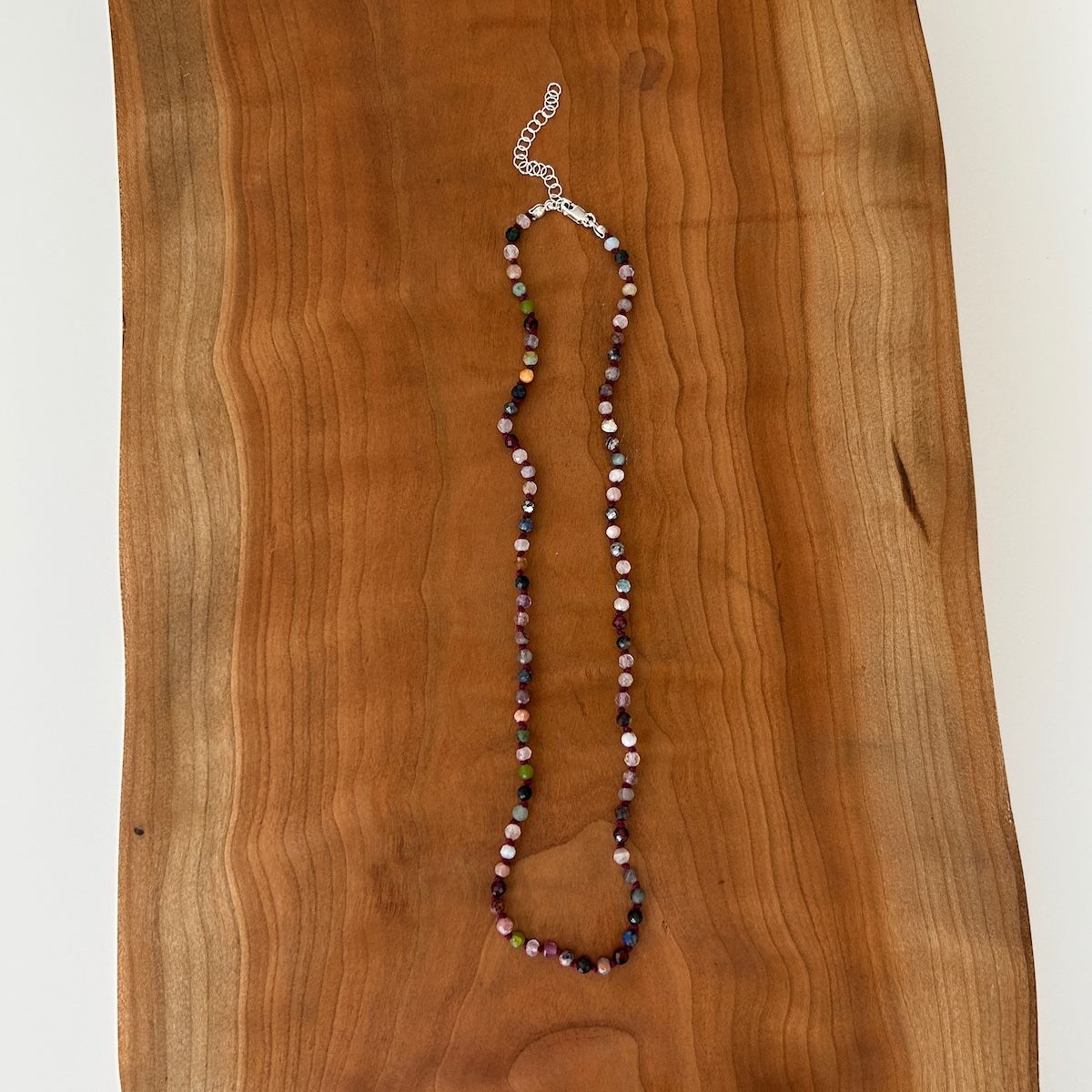 Handmade Necklace with assorted small gemstones knotted on red silk