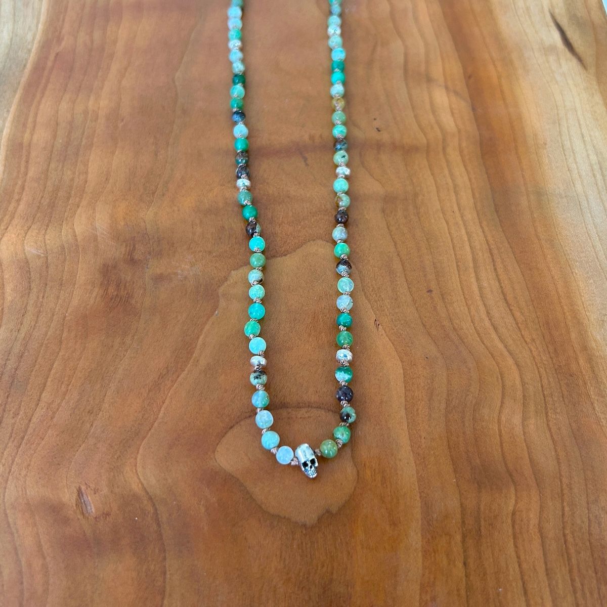 Handmade Necklace with chrysoprase, silver discs, skull knotted on tan silk