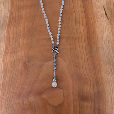 Handmade Necklace with white pearl knotted on grey silk, oxidized pendant