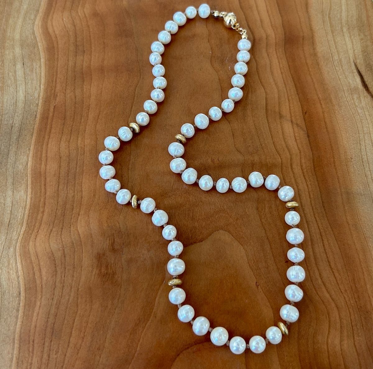 Handmade Necklace with white pearls, 14k gf saucers knotted on tan silk