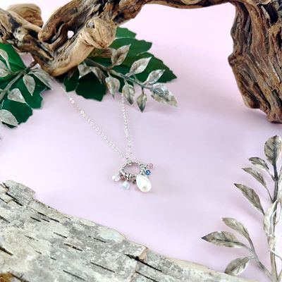 Handmade Necklace with faceted ring, white pearl, sky blue topaz, green tourmaline, pink tourmaline, rainbow moonstone,
