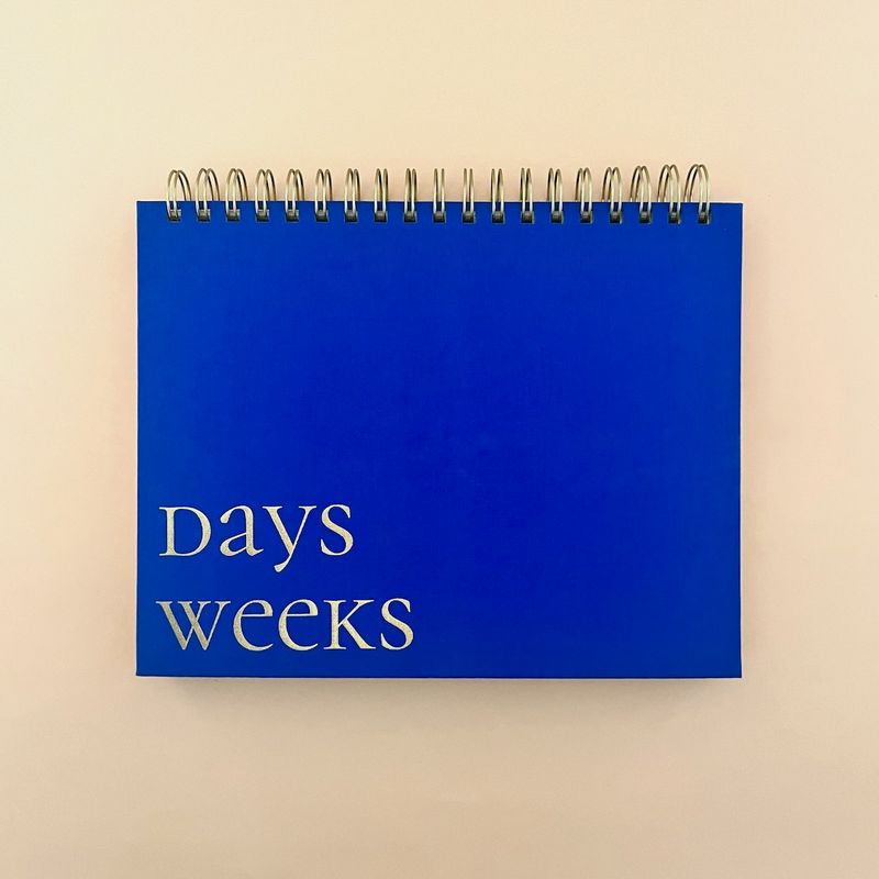 Cobalt Blue Fabric-Covered Spiral Weekly Desk Pad