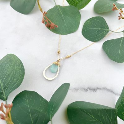 Handmade necklace with aqua chalcedony teardrop wrapped in 14k gf and nested in sterling teardrop on 16-in goldfill chain