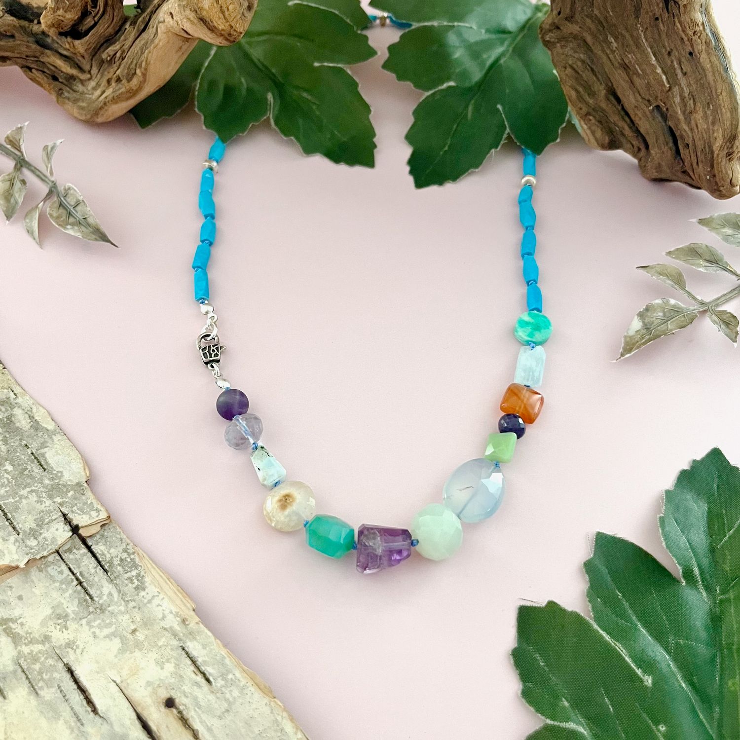 Handmade Necklace with turquoise, assorted gems knotted on blue silk