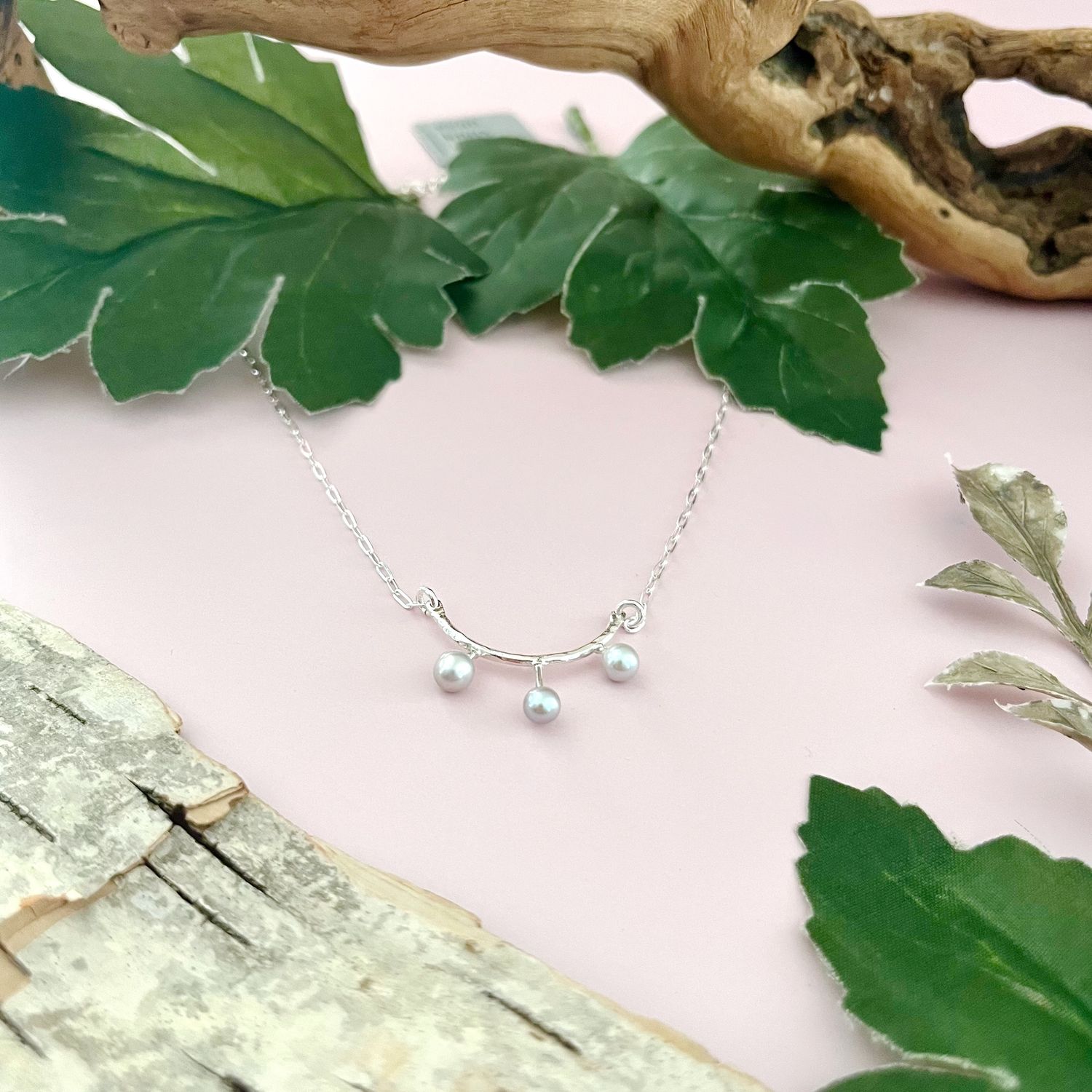 Hand-built silver pendant with three grey pearl drops