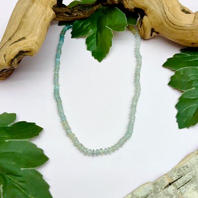 Handmade Necklace with graduated aquamarine knotted on hand dyed green silk