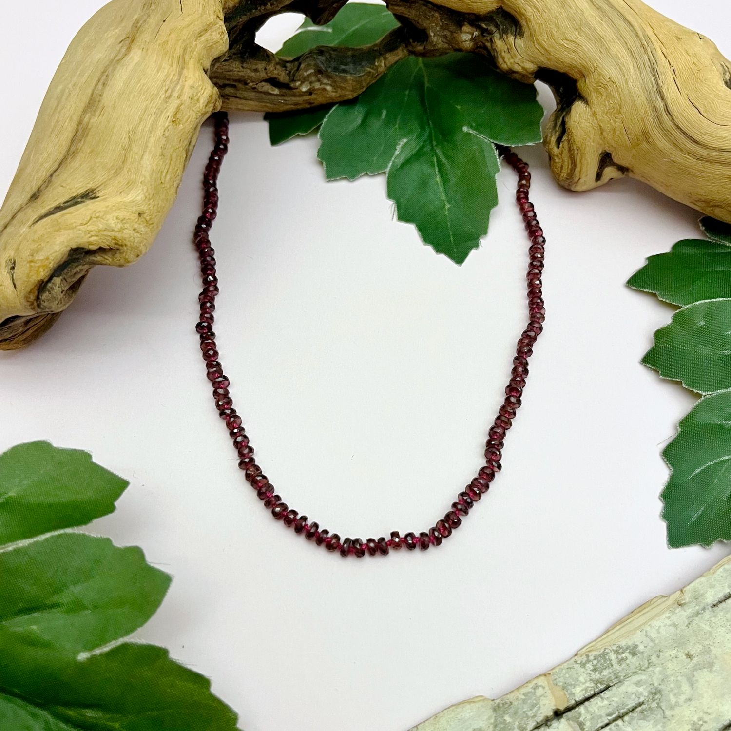 Handmade Necklace with garnet heishi knotted on red silk