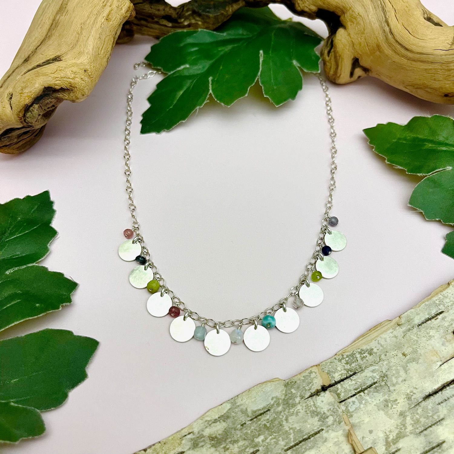 Handmade Necklace with 10 hammered discs, spinel, sodalite, peridot, larimar, rainbow moonstone, aquamarine, tourmaline, iloite