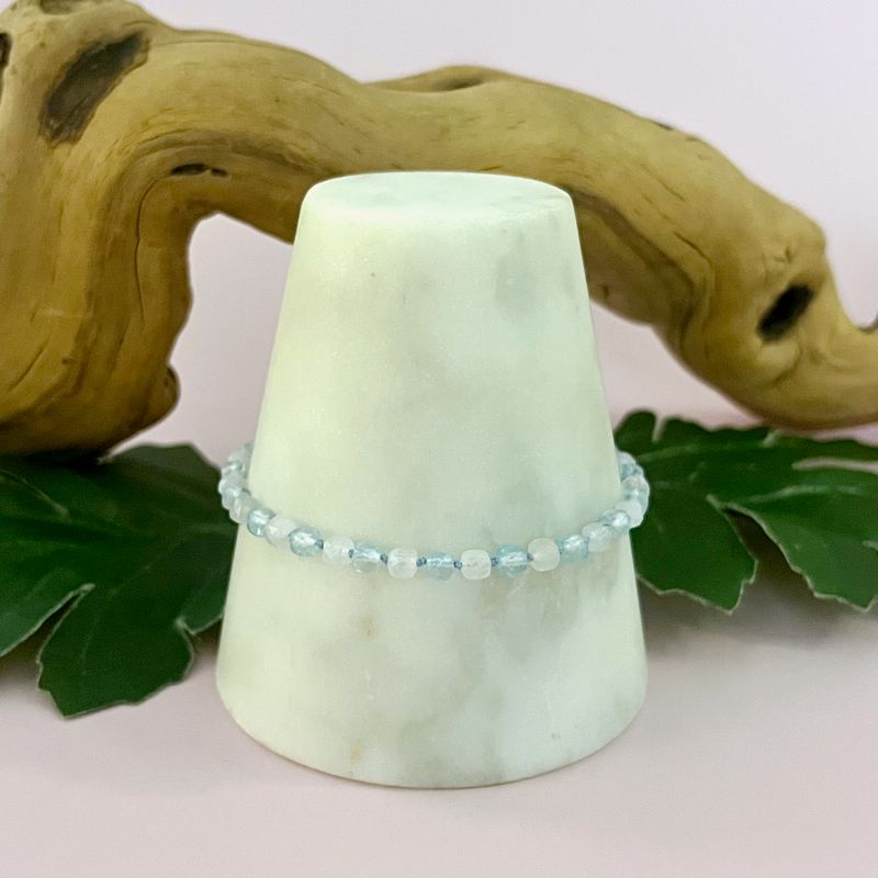 Handmade Bracelet with rainbow moonstone, sky blue topaz cubes knotted on blue silk