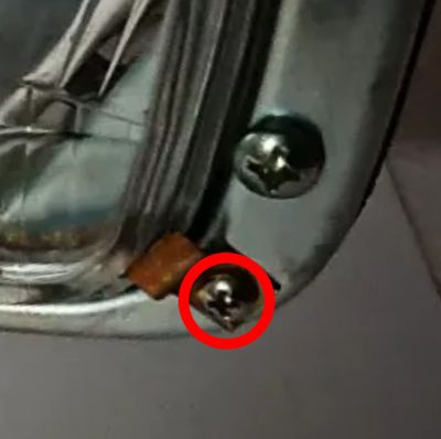 #064 Screw for holding headlight lens