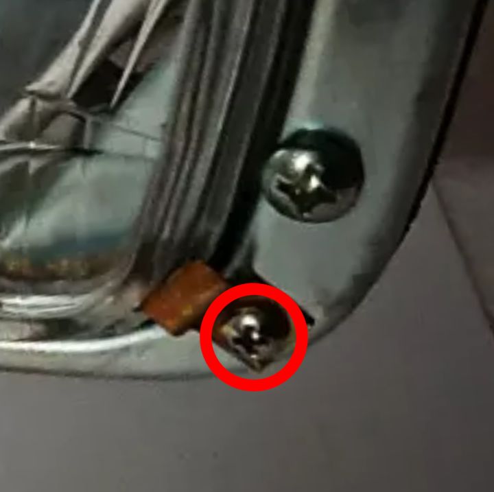 #064 Screw for holding headlight lens