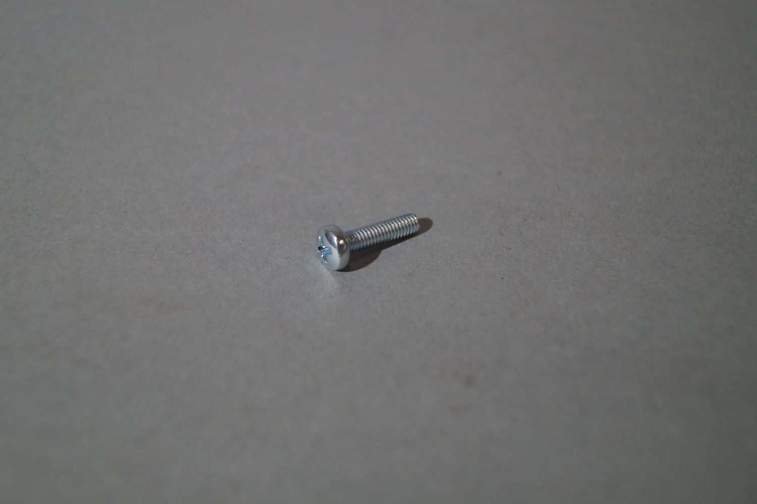 #102 Bolt, connecting Headlight Bezel to Headlight-unit