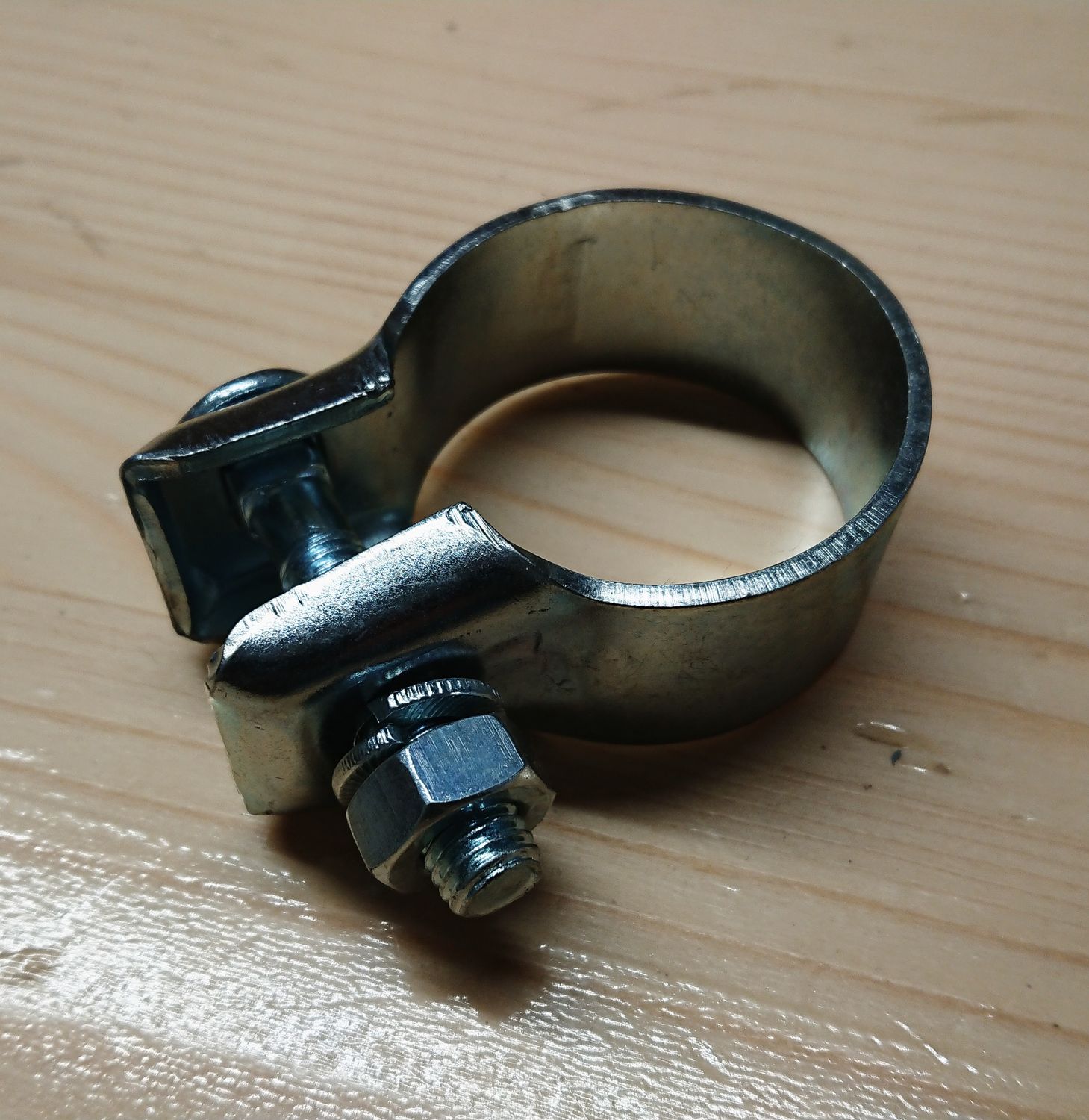 #023 Clamp for connecting exhaust muffler to exhaust pipes. Aftermarket