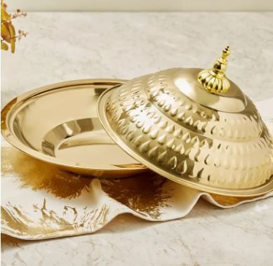 Traditional gold serving platter with decorative dome cover for buffets
