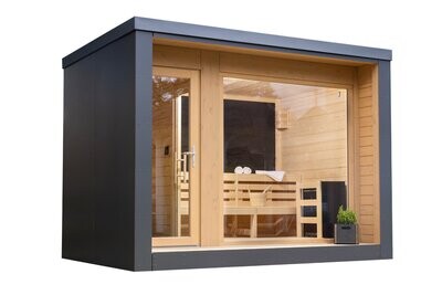 Modernes Saunahaus in kubischer Form mit anthrazitfarbener HPL-Fassade und großzügiger Glasfront – ein stilvoller Rückzugsort für ganzjährige Entspannung.