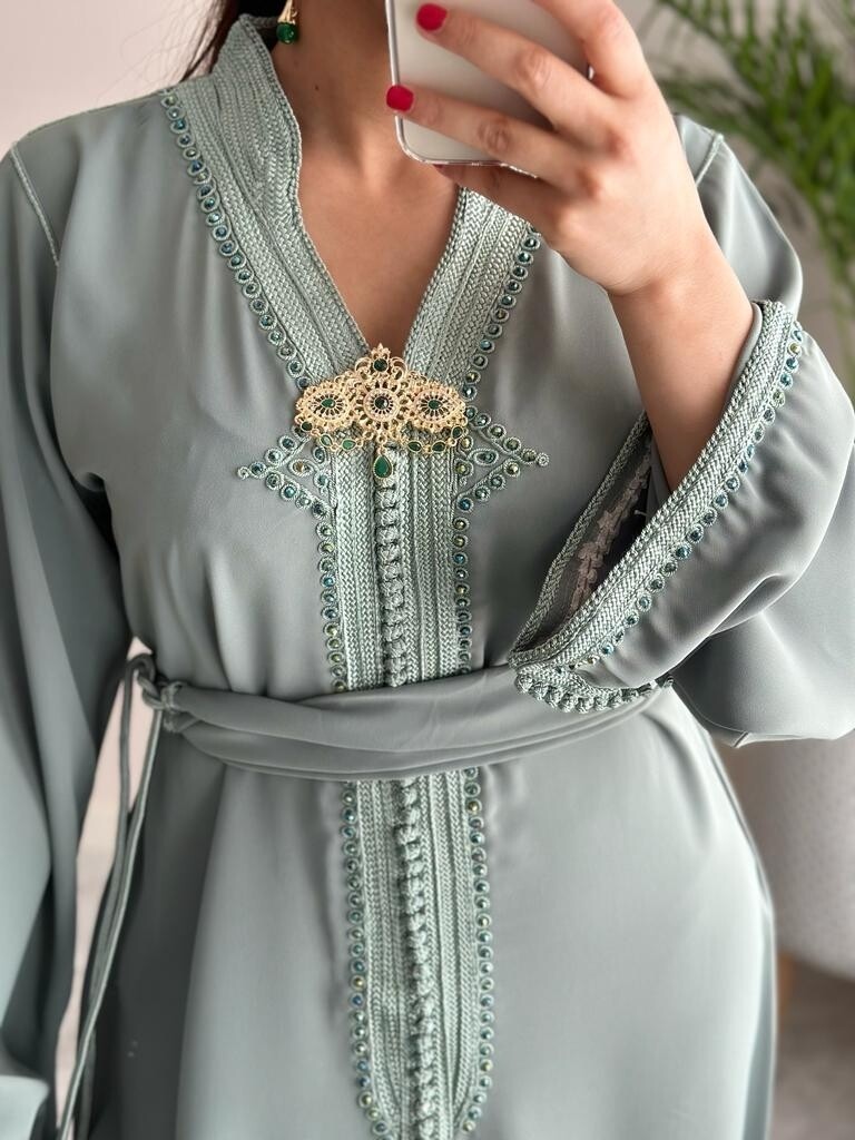 Traditional Brooch in Gold with green stones