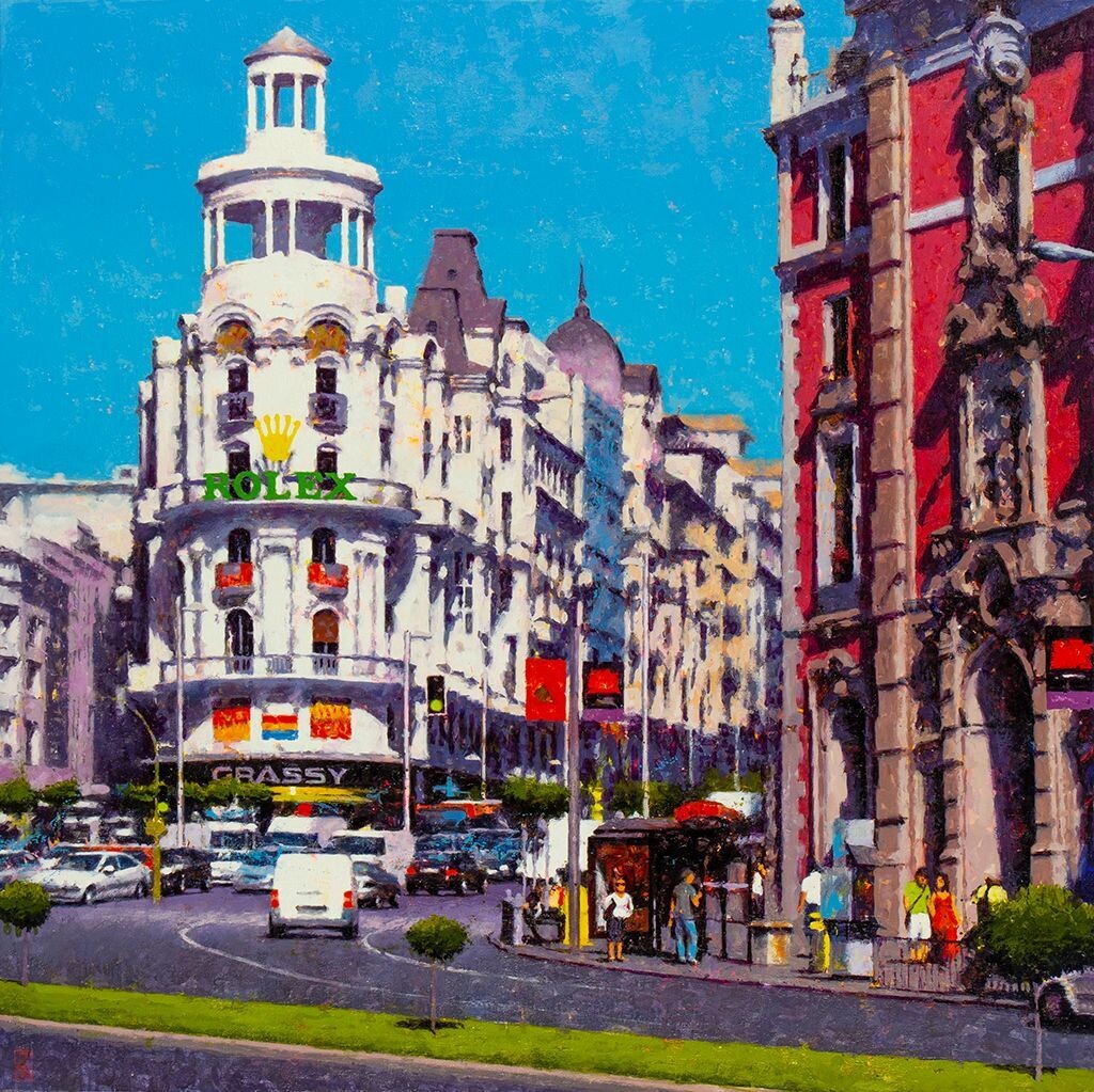 La Gran Vía con la calle Alcalá de Madrid con el edificio Grassy al fondo y la iglesia de San José a su derecha