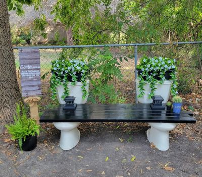 Serenitys boutique backyard bench planter arrangement