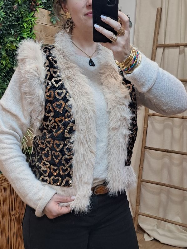 Le gilet sans manches fourrure