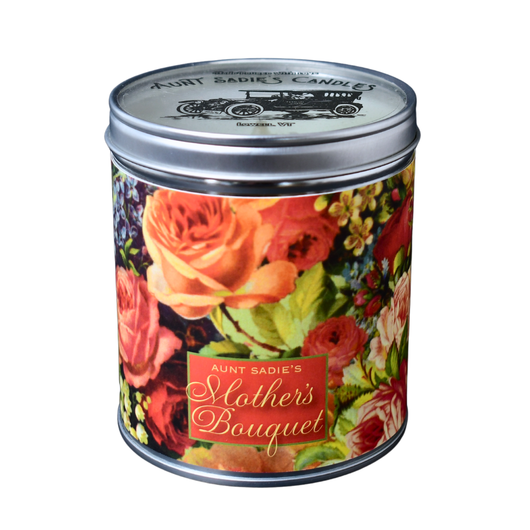 An Aunt Sadie's candle labeled "Aunt Sadie's Mother's Bouquet" over a background of bouquet flowers.
