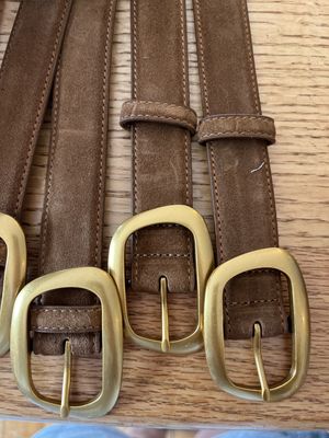 dark brown suede asymetrical round gold buckle