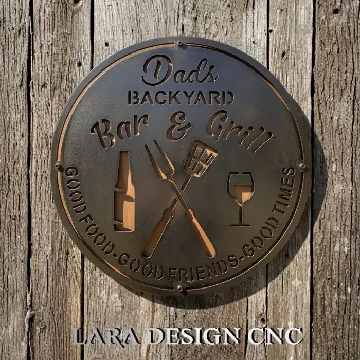 Dad's Backyard Bar and Grill metal sign CNC plasma cut out hanging on a rustic patio wall.